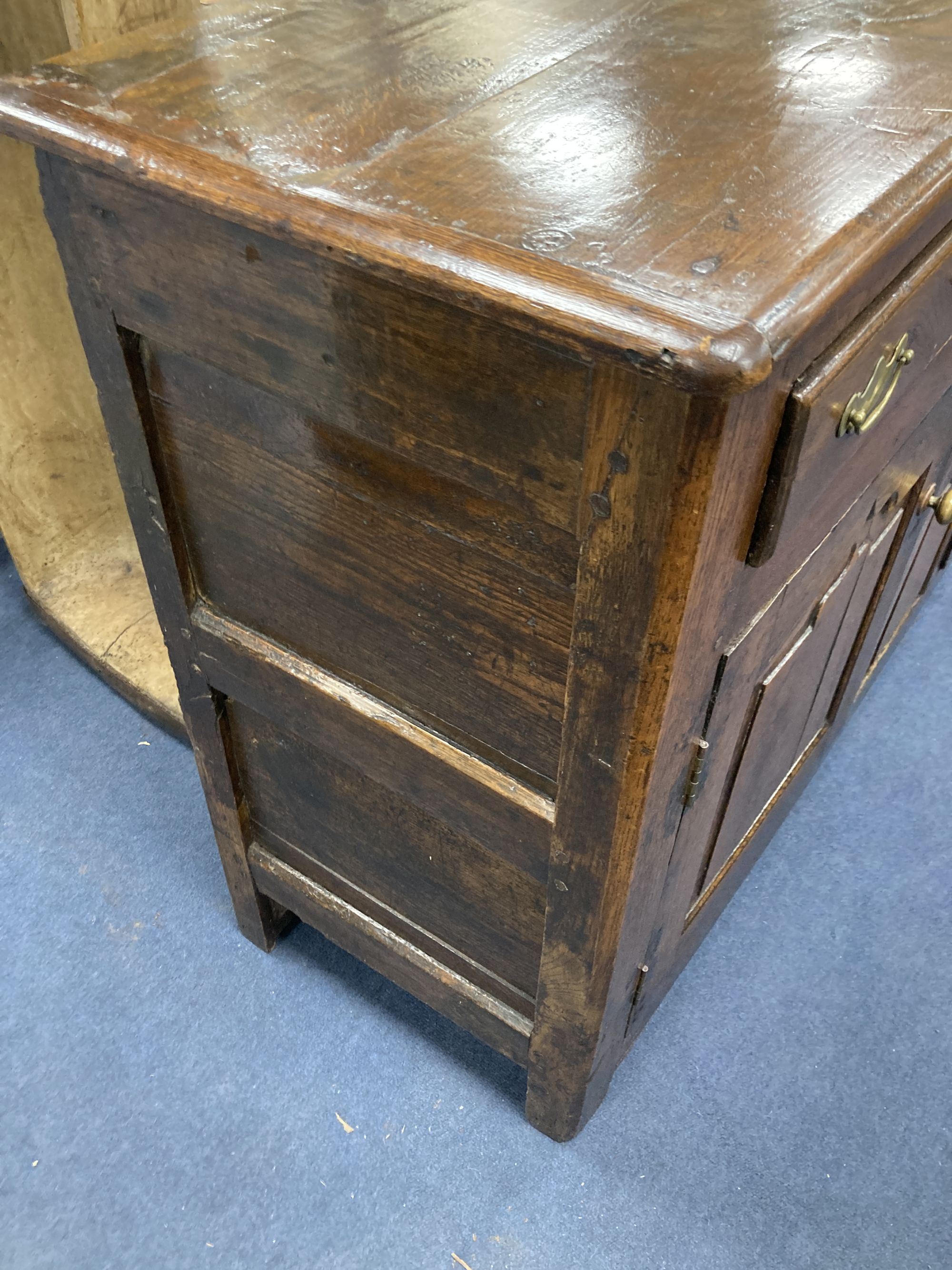 A mid 18th century oak dresser base, length 140cm, depth 46cm, height 86cm